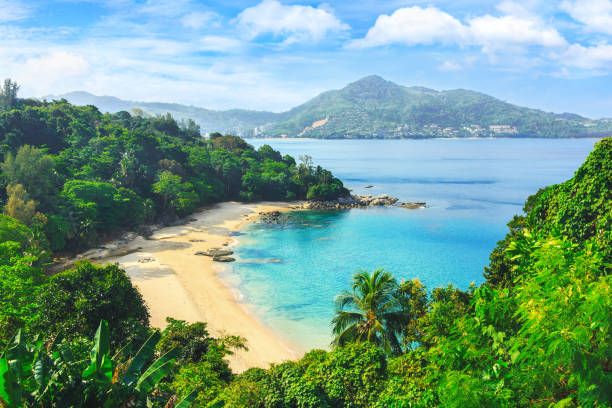 Picturesque view of Andaman sea in Phuket island, Thailand. View through the jungle on the beautiful bay and mountains. Tropical beach Laem Singh. Exotic views through the jungle to uninhabited beach. Blue lagoon. Picturesque bay. Laem sing beach. andaman sea stock pictures, royalty-free photos & images