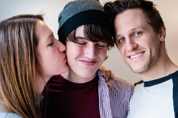 istock Portrait of three affectionate siblings at home. 932314208