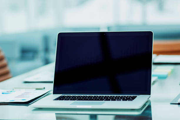 istock workplace with open laptop and financial documents prepared for meeting business partners 932314692
