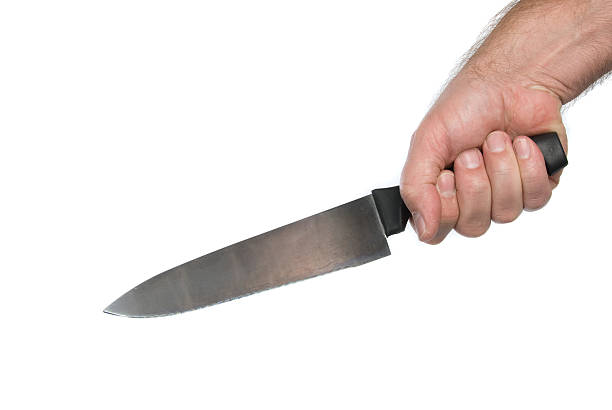 istock Single hand with a butcher's knife over a white background 93232228