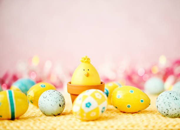 istock Easter background with baby chick and yellow and blue Easter eggs 932322360