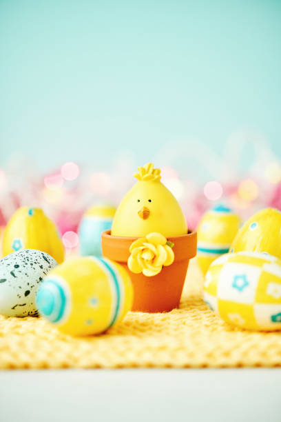 istock Easter background with baby chick and yellow and blue Easter eggs 932322452
