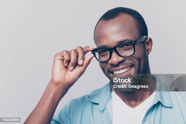 ben Fordøjelsesorgan Alligevel Portrait Of Positive Smiling Attractive Guy With Black Skin Beaming Smile  Holding Eyelet Of Glasses On