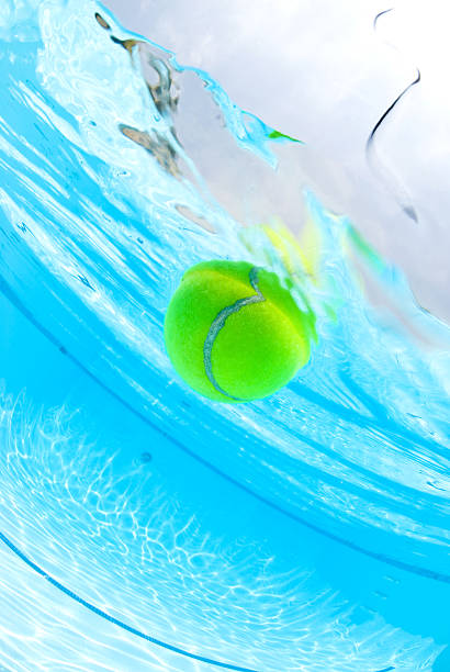 istock Tennis ball floating in swimming pool 93232958