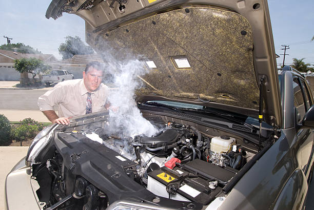 Man and his over heated car stock photo
