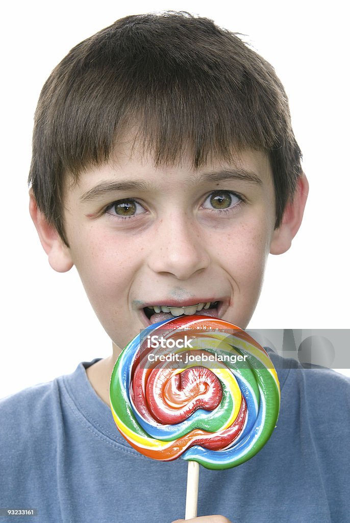 소년이며 그의 사탕 핀 휠 빨판 - 로열티 프리 귀여운 스톡 사진