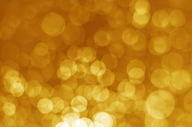 istock abstract gorgeous bright yellow gold bokeh background. 932331746