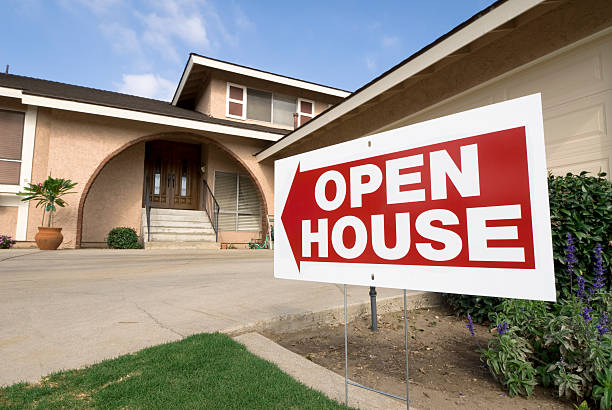 An open house sign outside a house stock photo