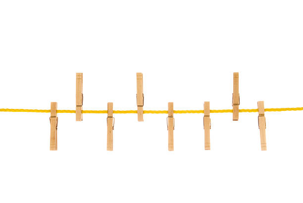 istock Clothesline and clothespins Isolated on white 93234284