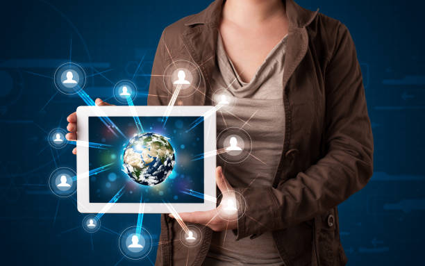 istock Woman presenting 3d earth globe in modern tablet 932344896