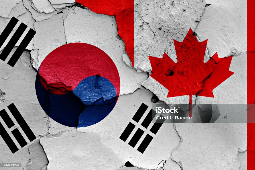 flag of South Korea and Canada painted on cracked wall Backgrounds Stock Photo