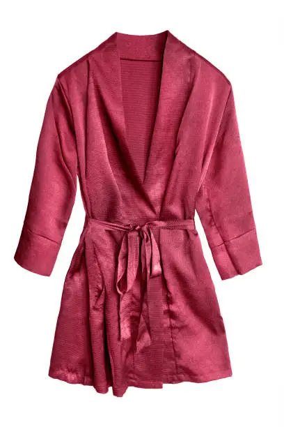 Red short satin bathrobe isolated over white