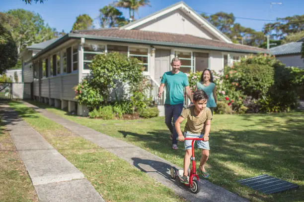 Photo of Australian family at home going for a walk