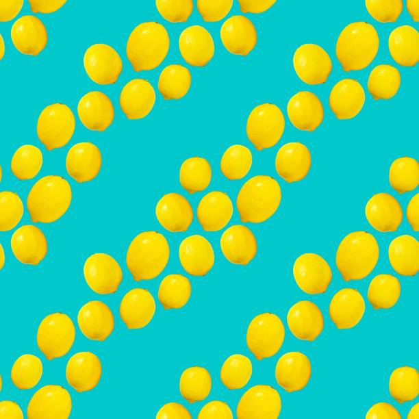 Seamless pattern lemons on cyan background diagonal line repeat design