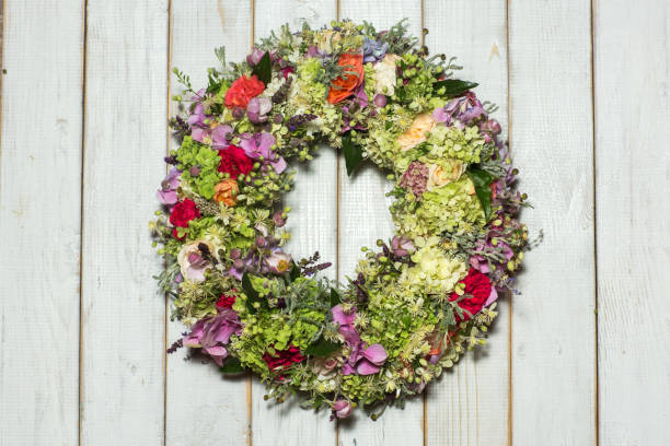 istock beautiful flower wreath isolated on awooden background 932350686