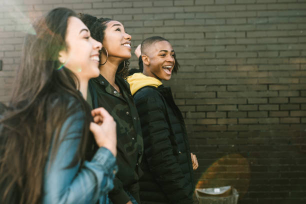 istock Group of College Students Walking To Class 932353356