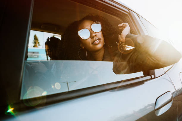 istock Group of Young Adults Having Fun Riding in Car 932354508