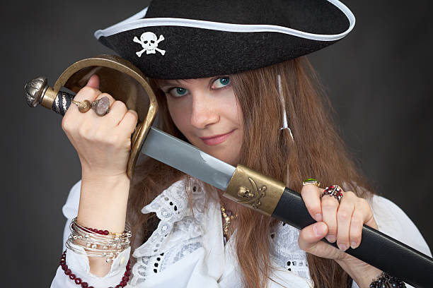 istock Girl in pirate hat with sabre 93235559