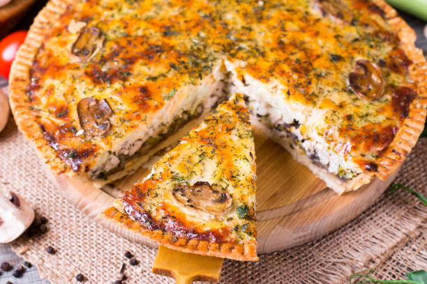 istock Pie with mushrooms, chicken on wooden kitchen board 932357614