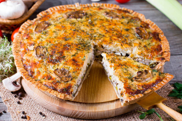 istock Pie with mushrooms, chicken on wooden kitchen board 932357712