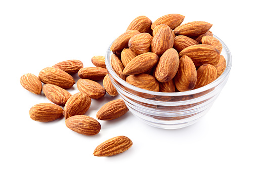 Almonds. Almond nuts in a glass bowl. Almond isolated.
