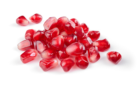 Pomegranate. Pomegranate seeds isolated on white. Full depth of field.