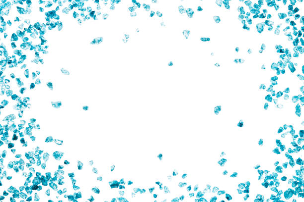 istock Blue crystals of sea salt. Frame on white background 932361248