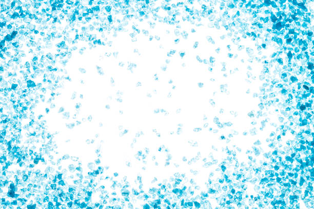 istock Blue crystals of sea salt. Frame on white background 932361368