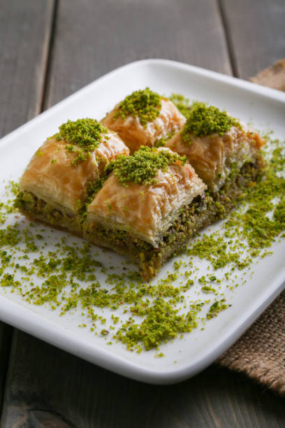 istock Baklava with pistachio vertical close up 932362058