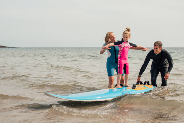 istock Little Girl Learning how to Surf 932364420