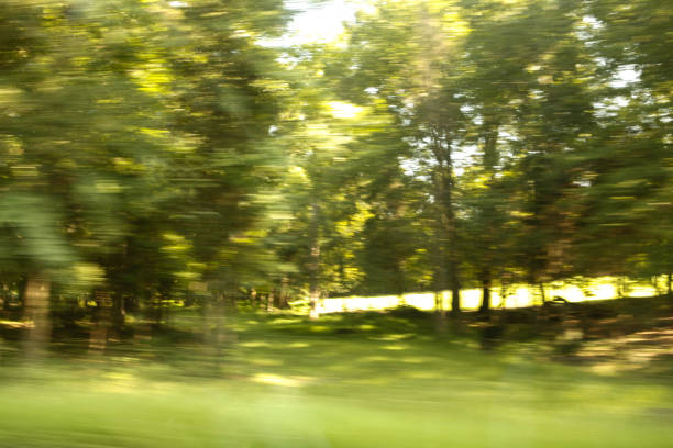 istock A rural landscape in blurred motion viewed from a moving car 932372572