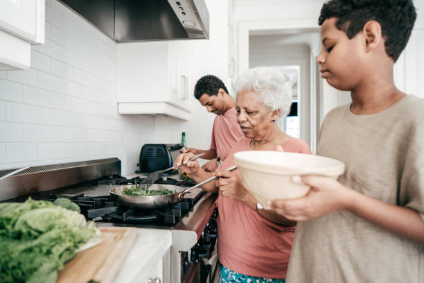 istock Grandmother cooking family dinner 932380940