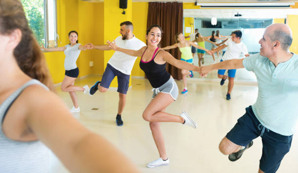 istock Positive people exercising in dance hall 932381084