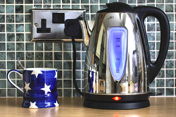 Electric kettle and cup stock photo