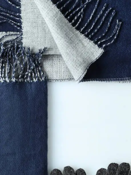 Navy blue winter scarf divided square vertical background with empty space for copy