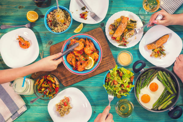 istock Young Family Having Lunch at Home 932390368