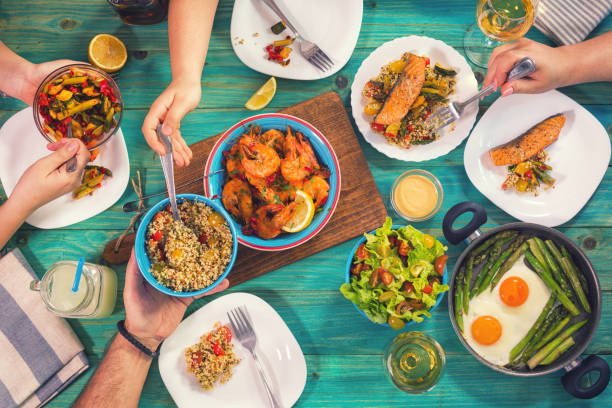 istock Young Family Having Lunch at Home 932392706