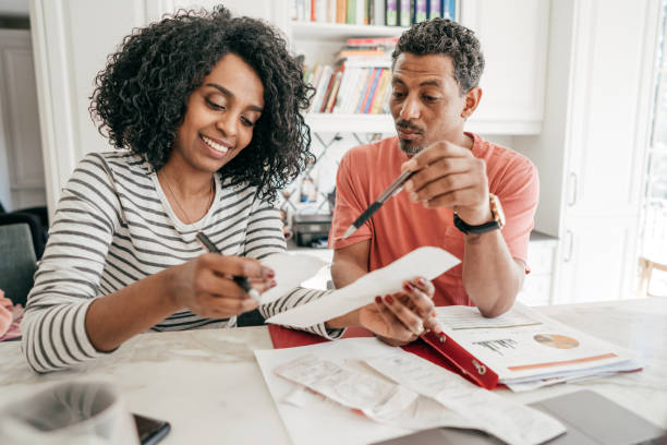 istock Couple making taxes together 932392806