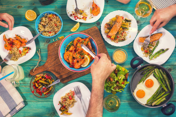 istock Young Family Having Lunch at Home 932392890