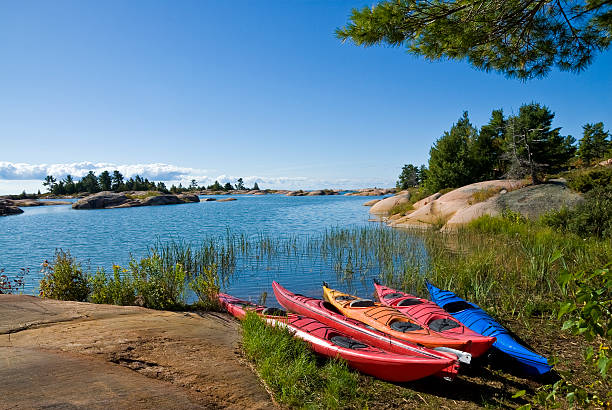 istock Colorful Kayaks by a Lake 93239717