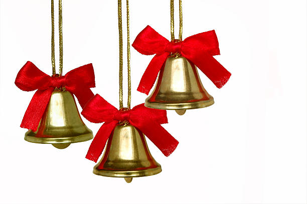 Three Christmas bells with red bows on a white background