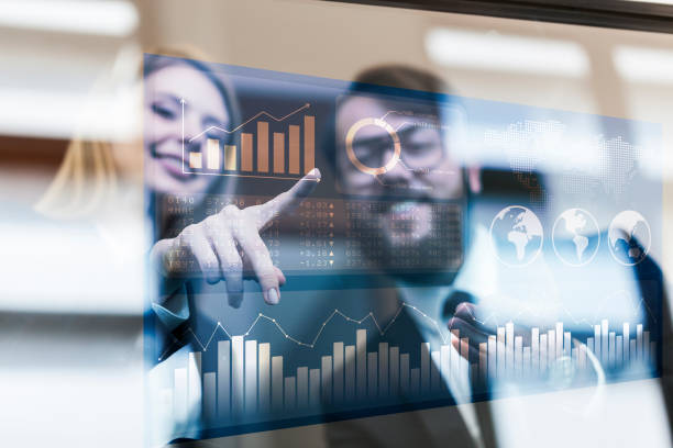 istock Busines couple discussing business profit on a modern interface 932405036