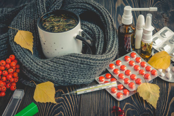 pills, nose drops and hot tea with lemon for colds, treatment of , flu  runny - flu virus russian influenza swine flu virus imagens e fotografias de stock