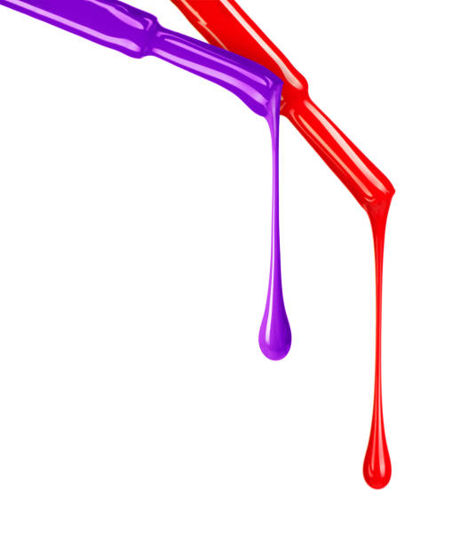 istock Colored nail polishes dripping from brushes close-up 932415562