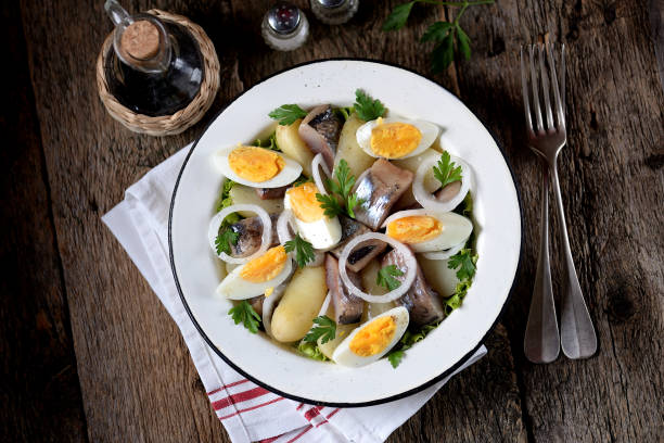 istock Salad from light-salted herring, boiled potatoes, eggs and onions 932417420