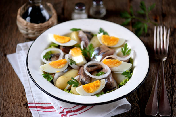 istock Salad from light-salted herring, boiled potatoes, eggs and onions 932417458