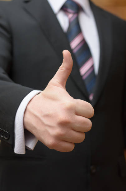 istock A businessman in an expensive suit makes a gesture with his hand - everything is ok. 932417980