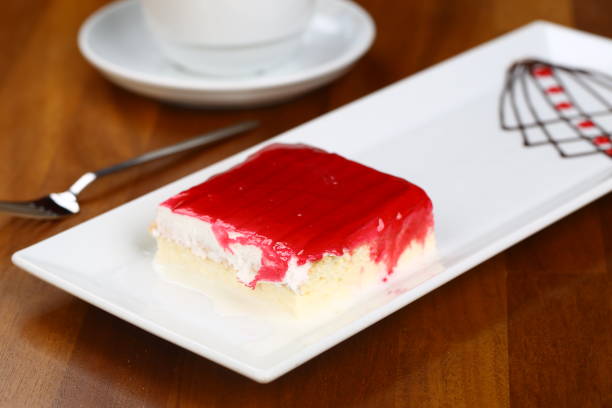 Unrecognizable man eating cake in coffee shop, close-up of cake