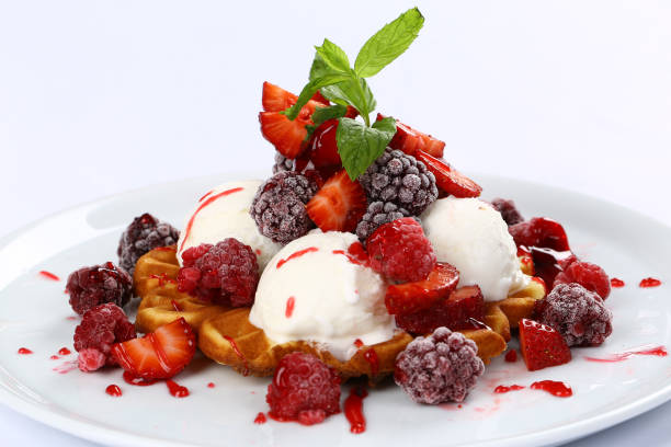 istock Belgian waffles with fresh berries and cream 932421514