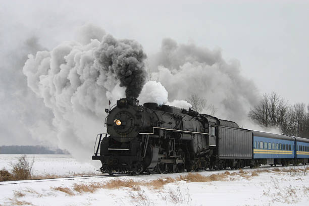 zug mit dampflokomotive - locomotive steam train train snow stock-fotos und bilder